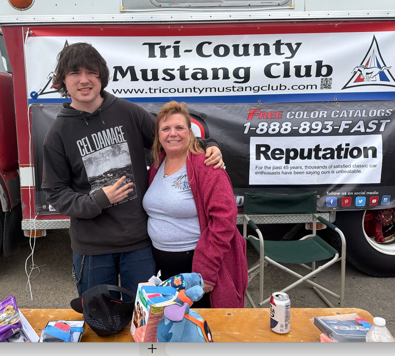 Tri-County Mustang Club President Teri Boyd at the club’s booth.
